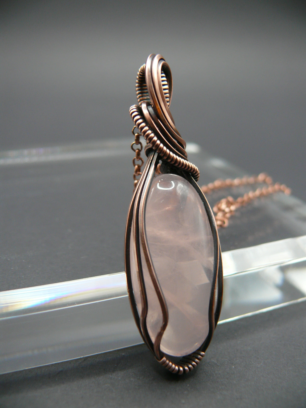 Copper wire wrapped rose quartz pendant