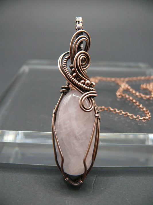 Pink rose quartz pendant wire wrapped in copper