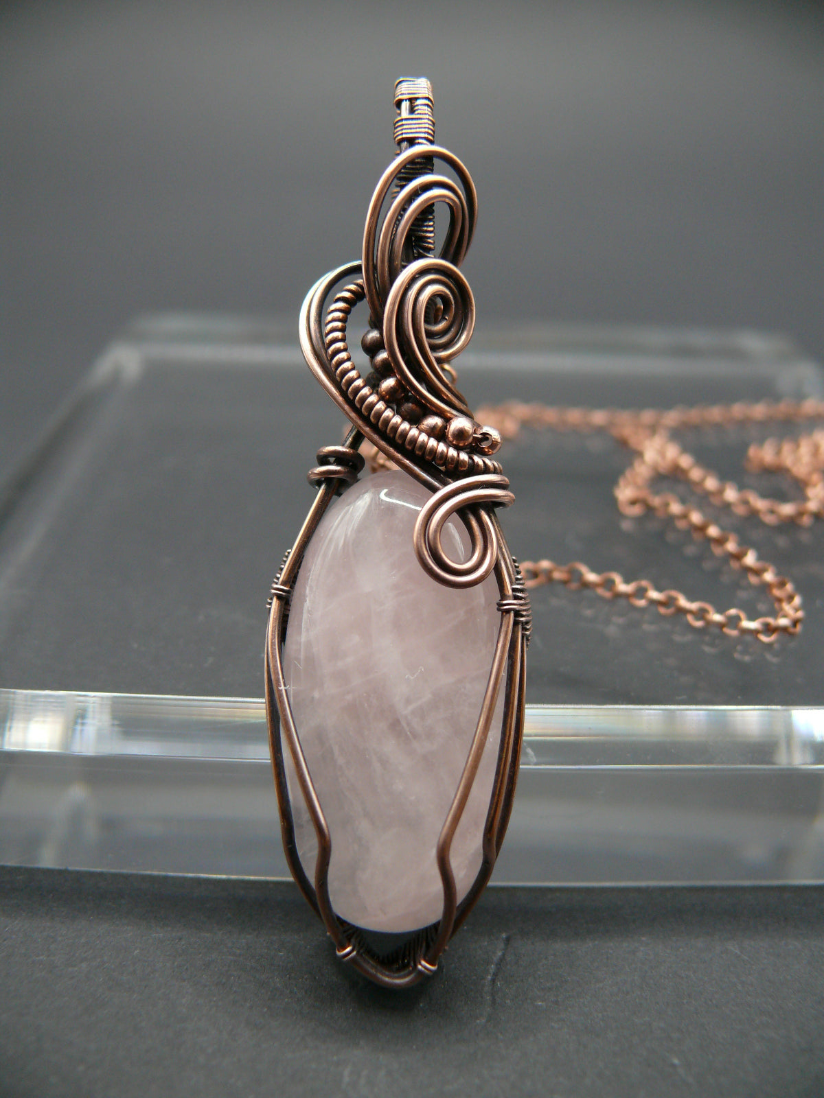 Pink rose quartz pendant wire wrapped in copper