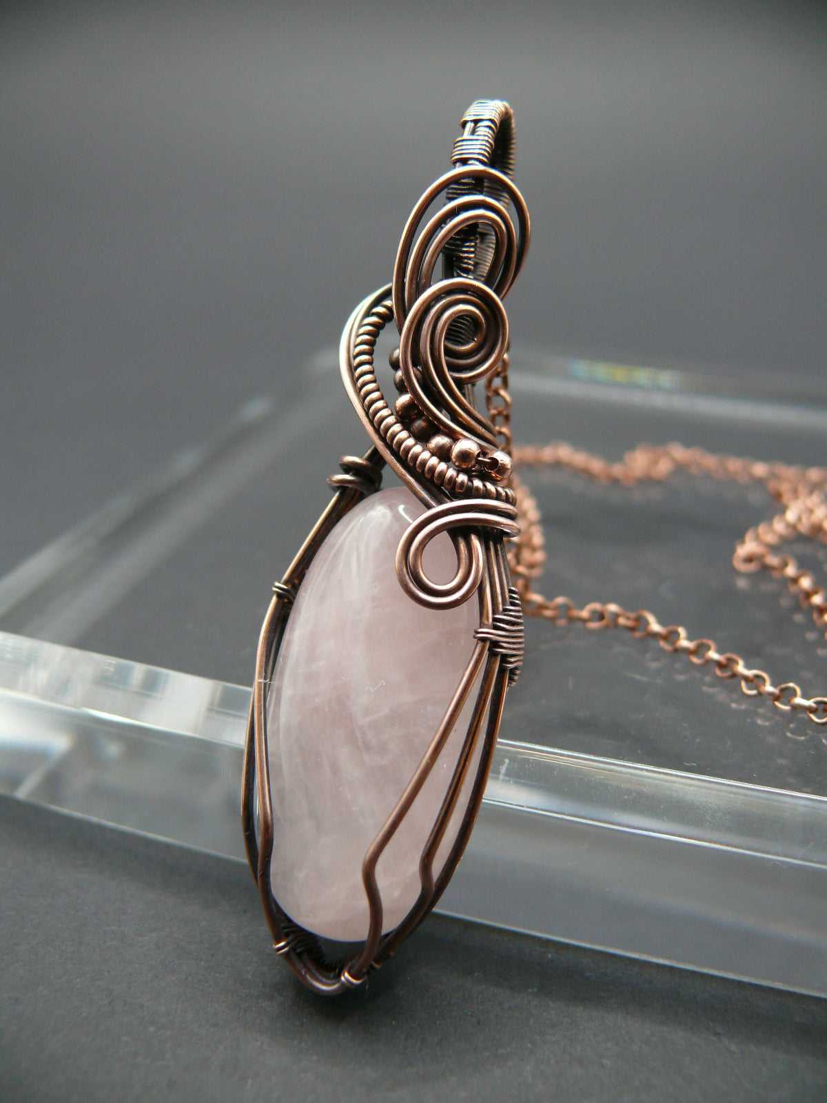 Pink rose quartz pendant wire wrapped in copper