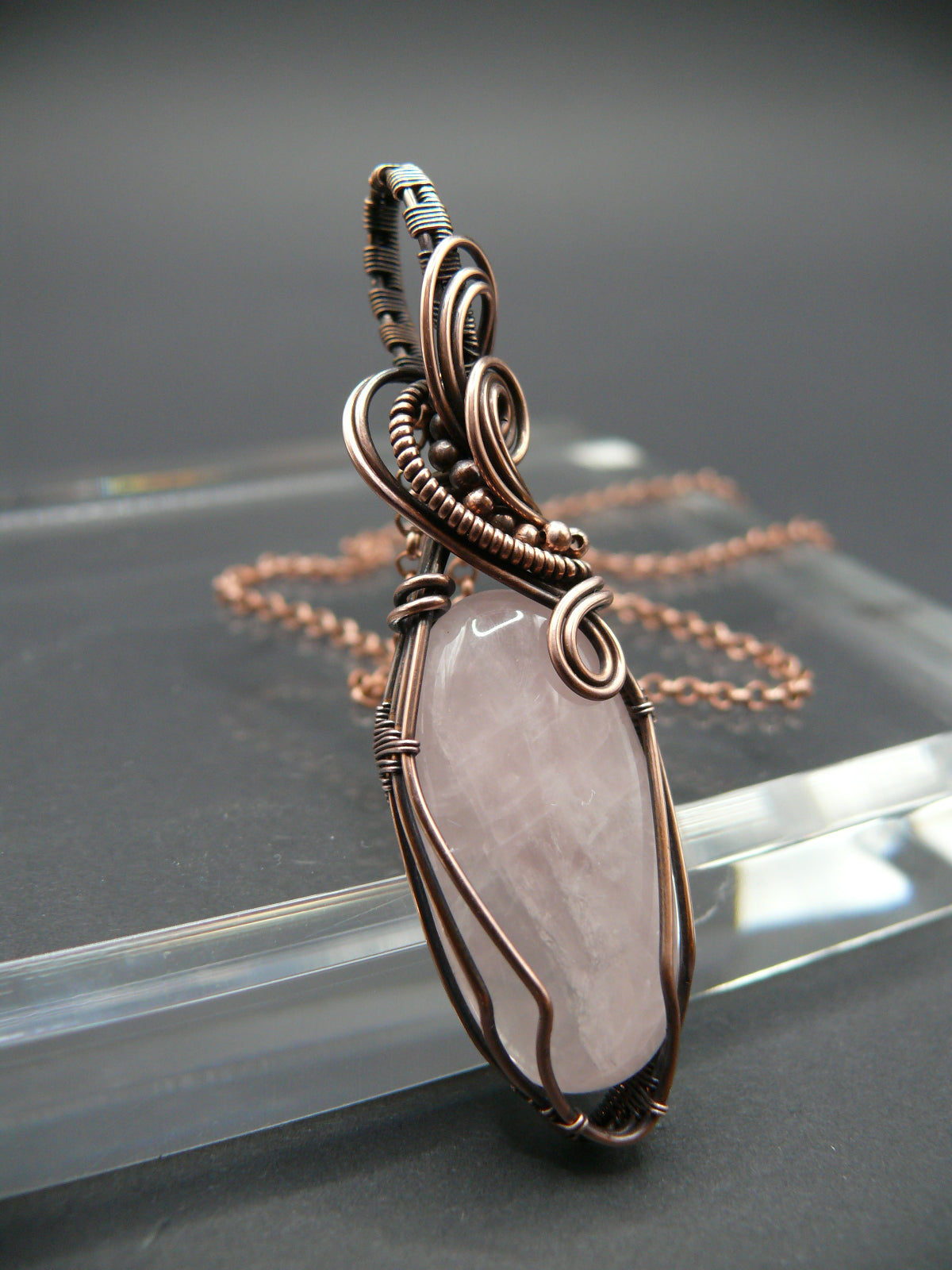 Pink rose quartz pendant wire wrapped in copper