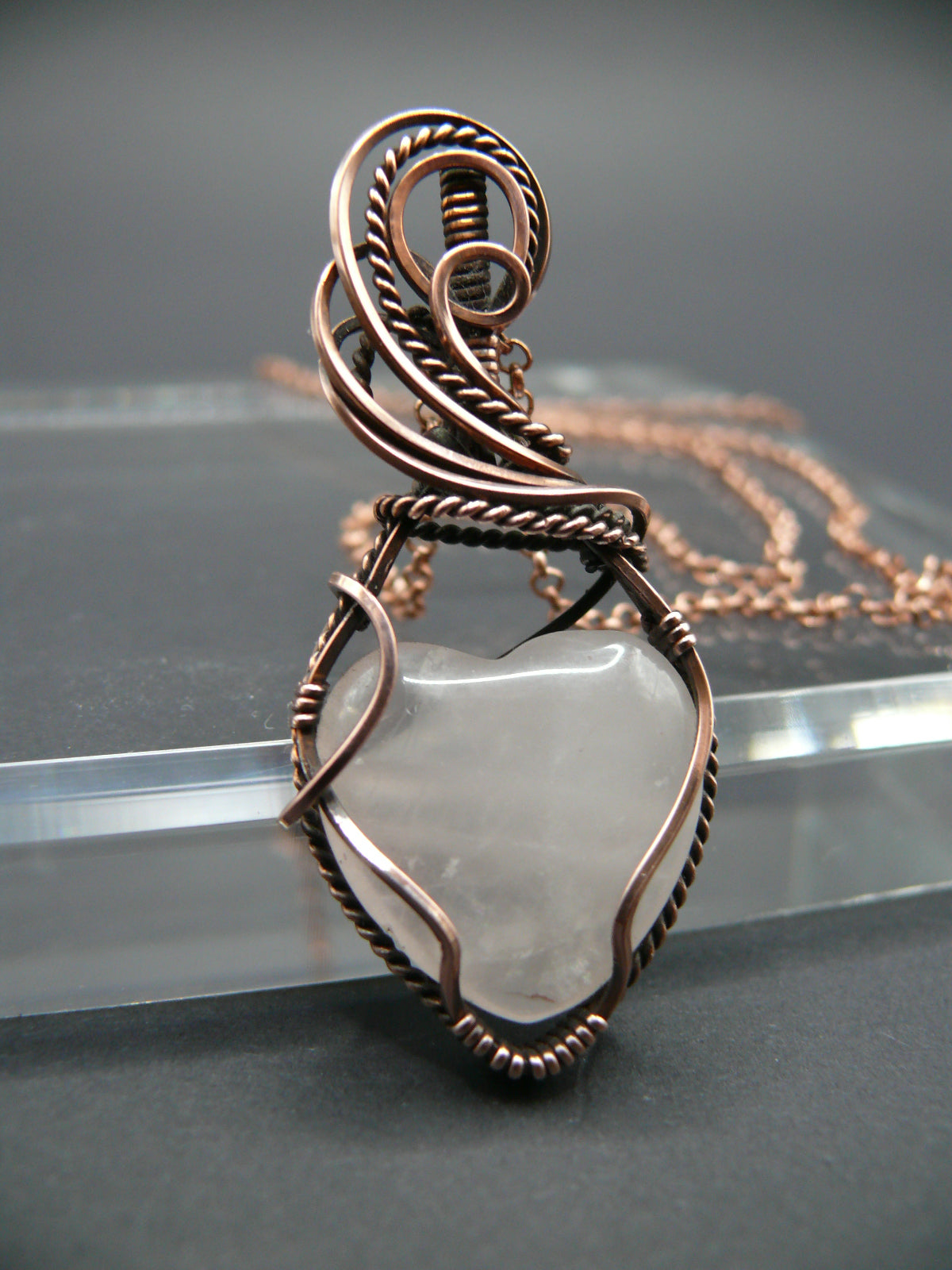 Copper wire-wrapped heart shaped pink rose quartz pendant