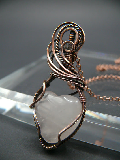 Copper wire-wrapped heart shaped pink rose quartz pendant