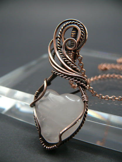 Copper wire-wrapped heart shaped pink rose quartz pendant