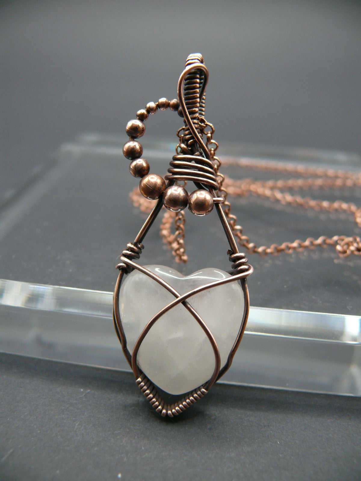 Copper wire-wrapped heart shaped pink rose quartz pendant