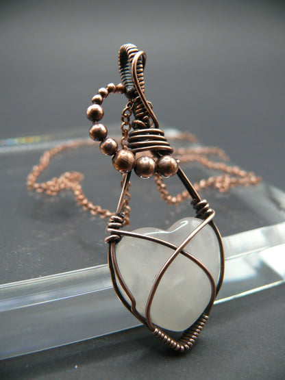 Copper wire-wrapped heart shaped pink rose quartz pendant