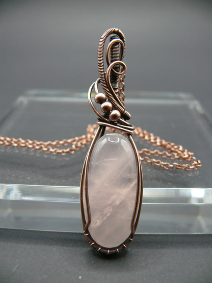 Handmade copper wire wrapped rose quartz pendant