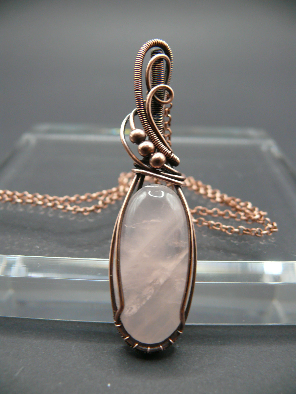 Handmade copper wire wrapped rose quartz pendant