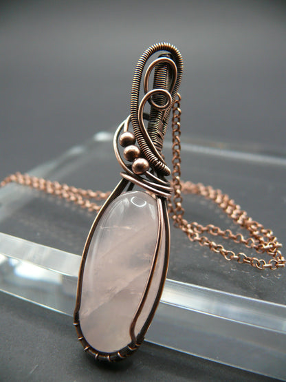 Handmade copper wire wrapped rose quartz pendant