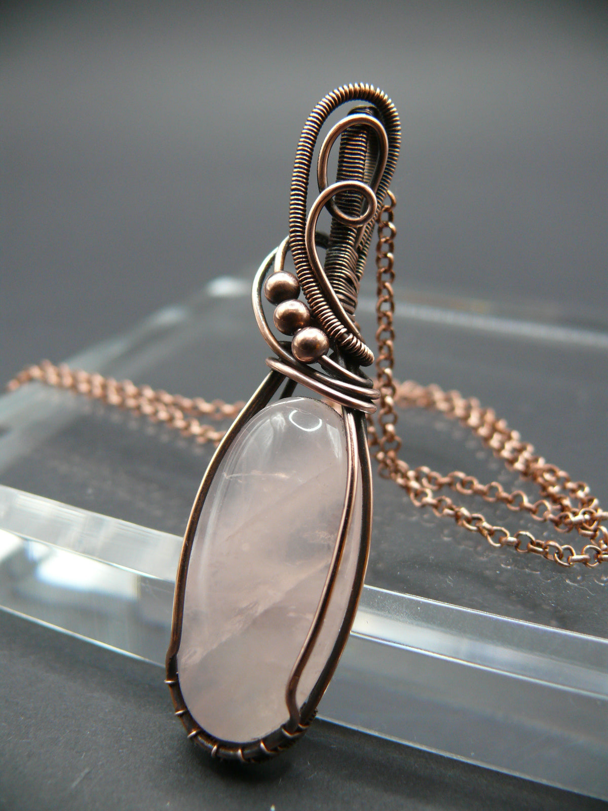 Handmade copper wire wrapped rose quartz pendant