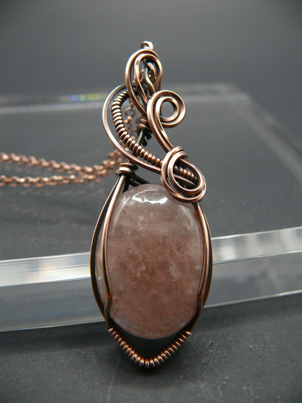 Wire wrapped strawberry quartz pendant