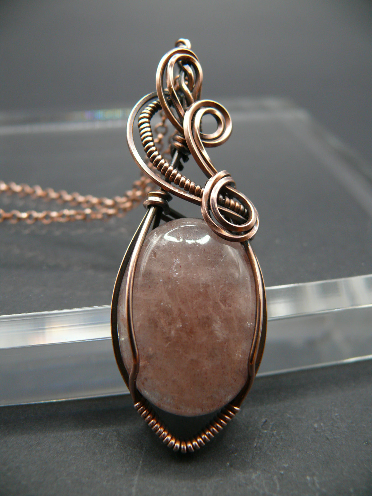 Wire wrapped strawberry quartz pendant