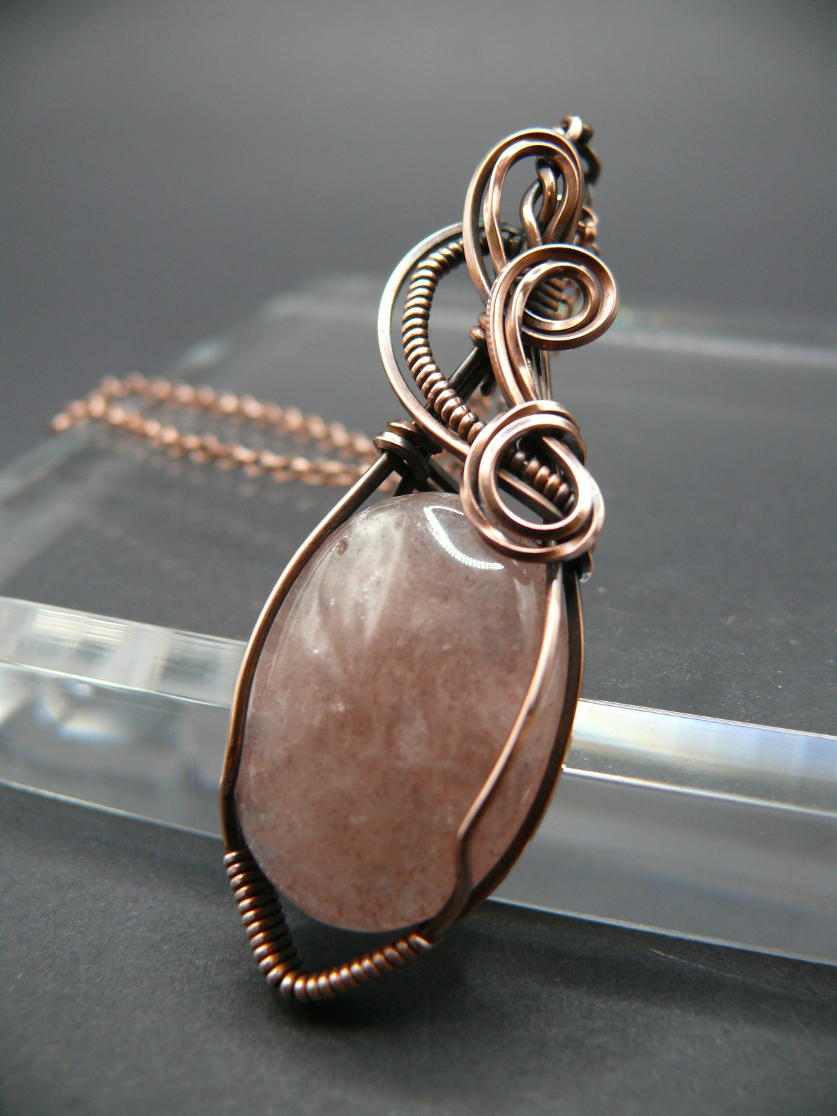 Wire wrapped strawberry quartz pendant