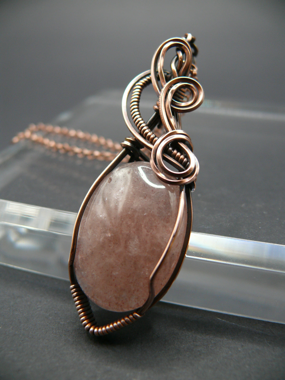 Wire wrapped strawberry quartz pendant