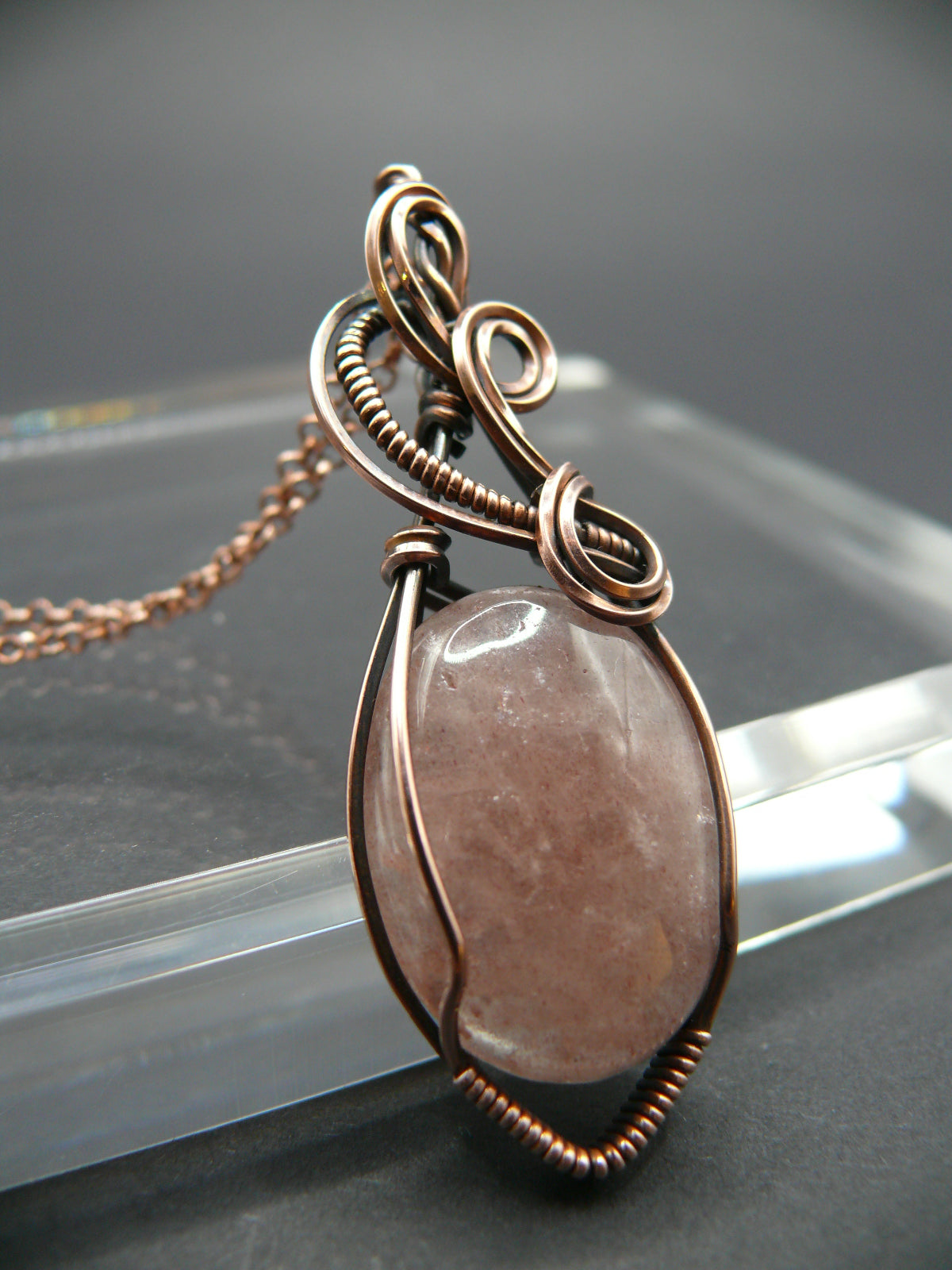 Wire wrapped strawberry quartz pendant