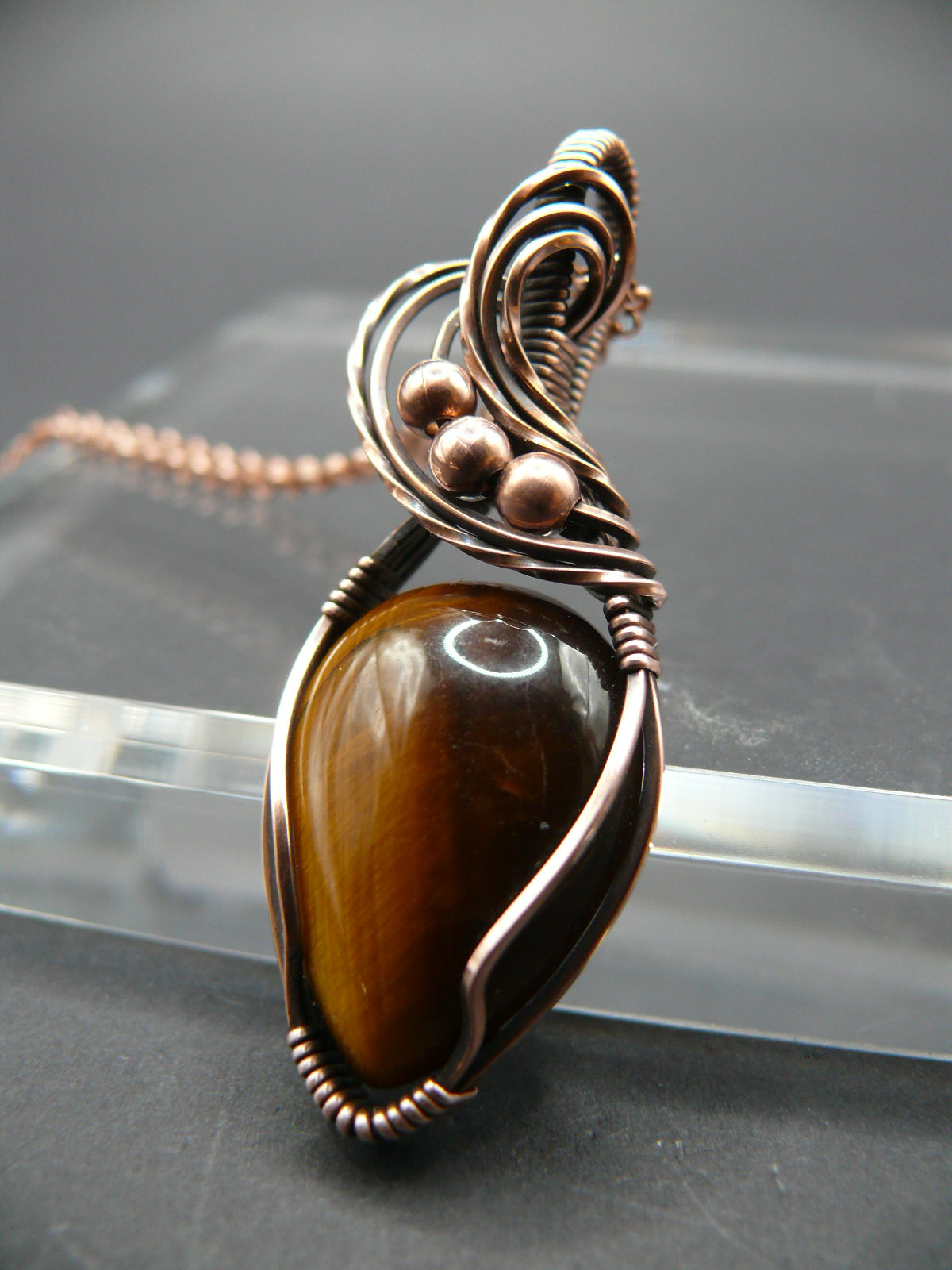 Artisan crafted tiger eye pendant wrapper in copper wire