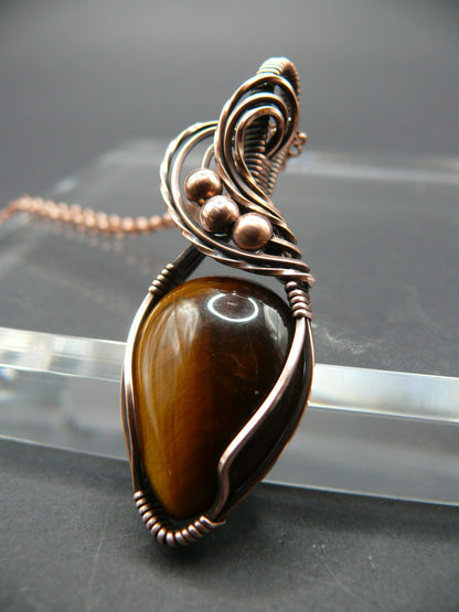 Artisan crafted tiger eye pendant wrapper in copper wire