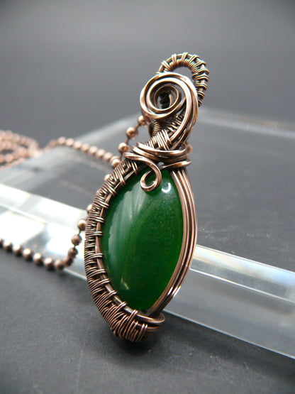 Copper wire weaved green jade pendant