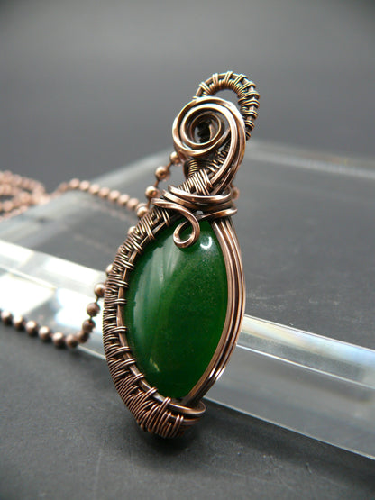 Copper wire weaved green jade pendant