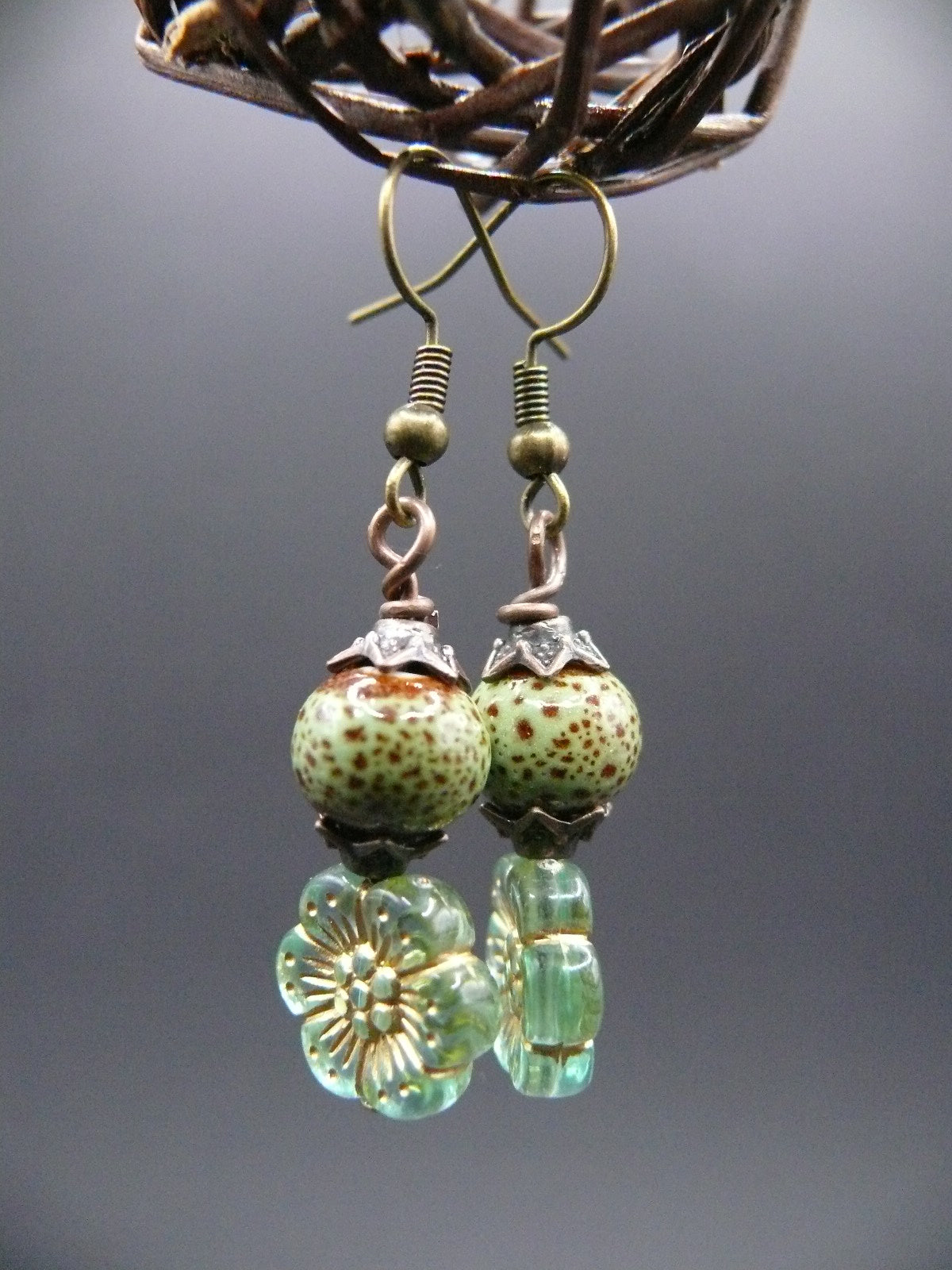 Ceramic bead and flower design dangle earrings