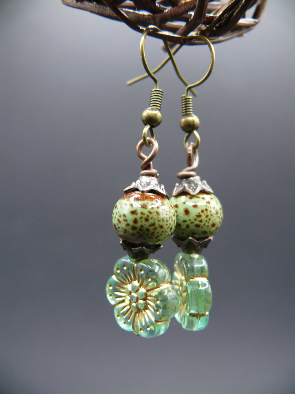 Ceramic bead and flower design dangle earrings