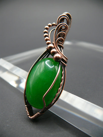 Copper-wrapped jade gemstone pendant