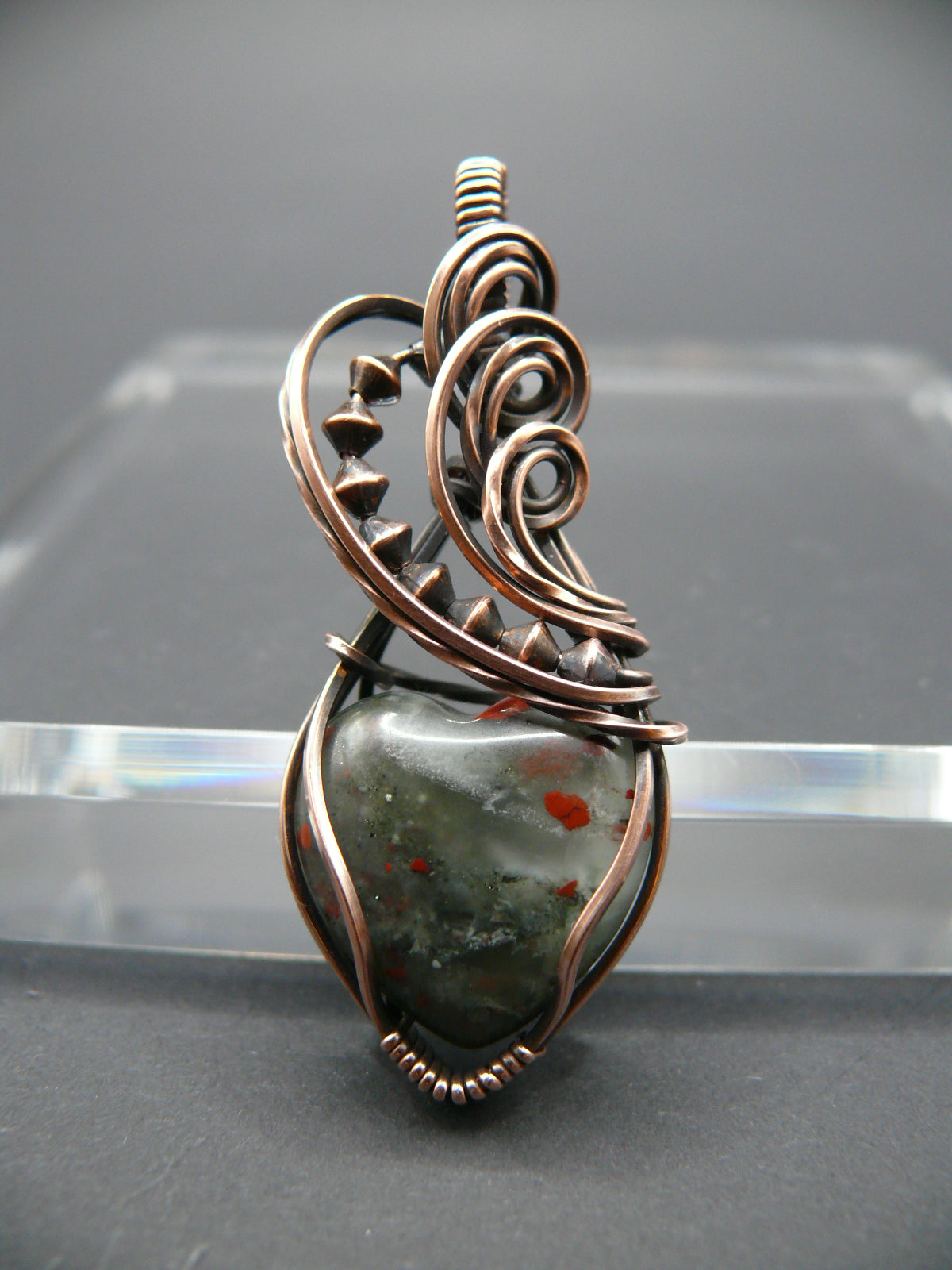 Heart shaped wire wrapped bloodstone gemstone pendant