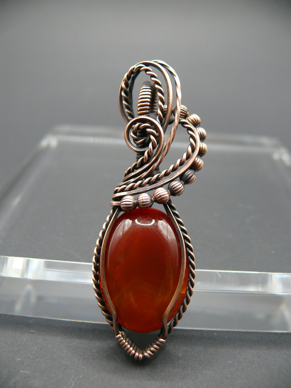 Wire wrapped deep red agate gemstone pendant