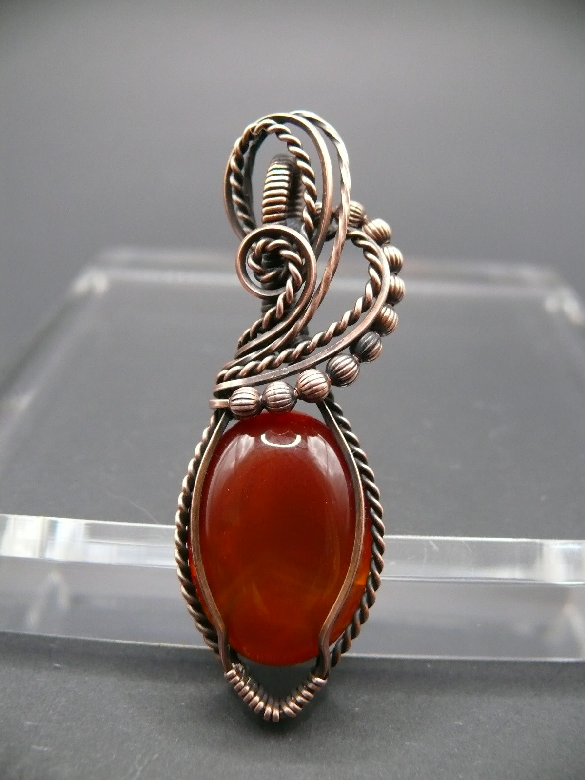 Wire wrapped deep red agate gemstone pendant