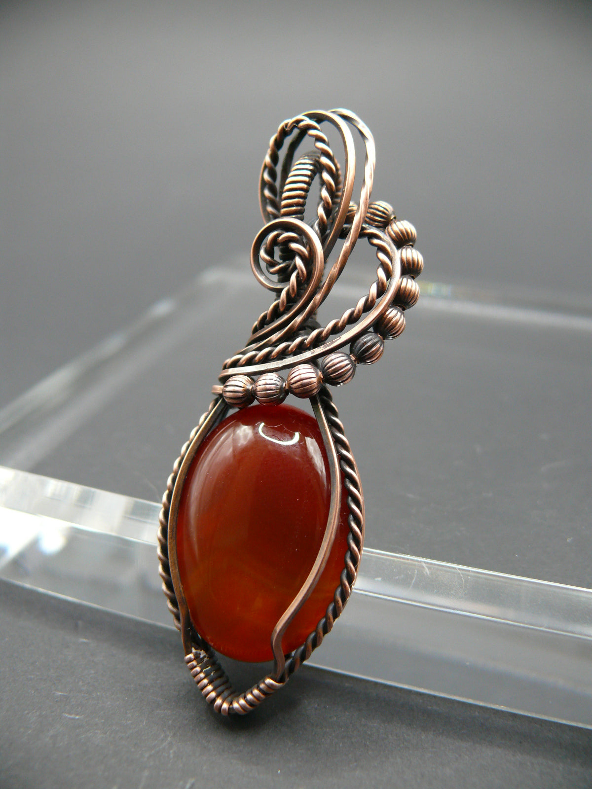 Wire wrapped deep red agate gemstone pendant