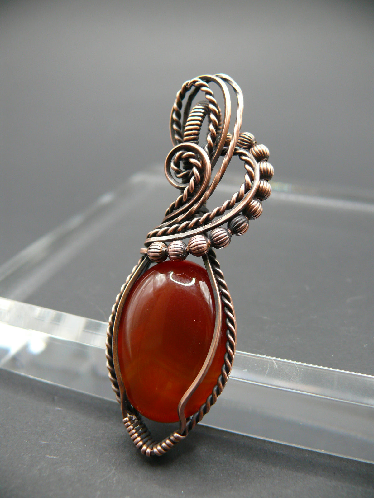 Wire wrapped deep red agate gemstone pendant