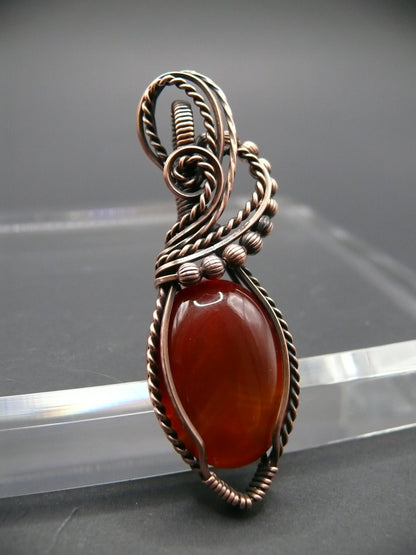 Wire wrapped deep red agate gemstone pendant