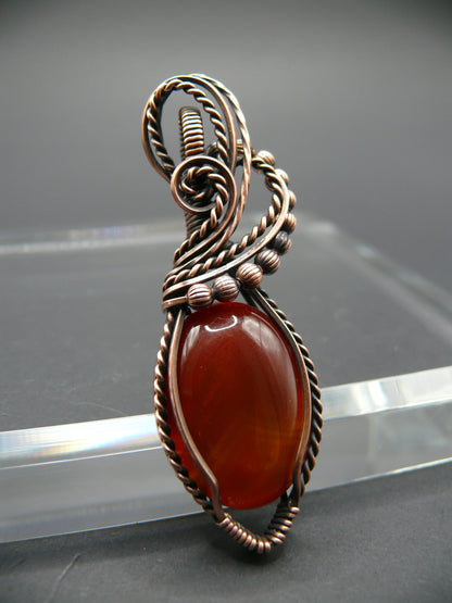 Wire wrapped deep red agate gemstone pendant