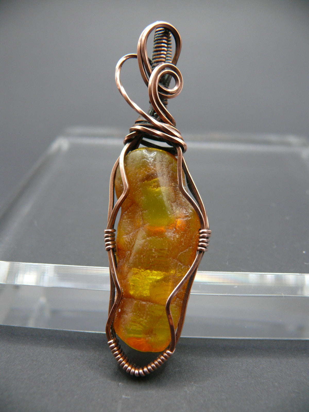 Wire wrapped raw Baltic amber pendant