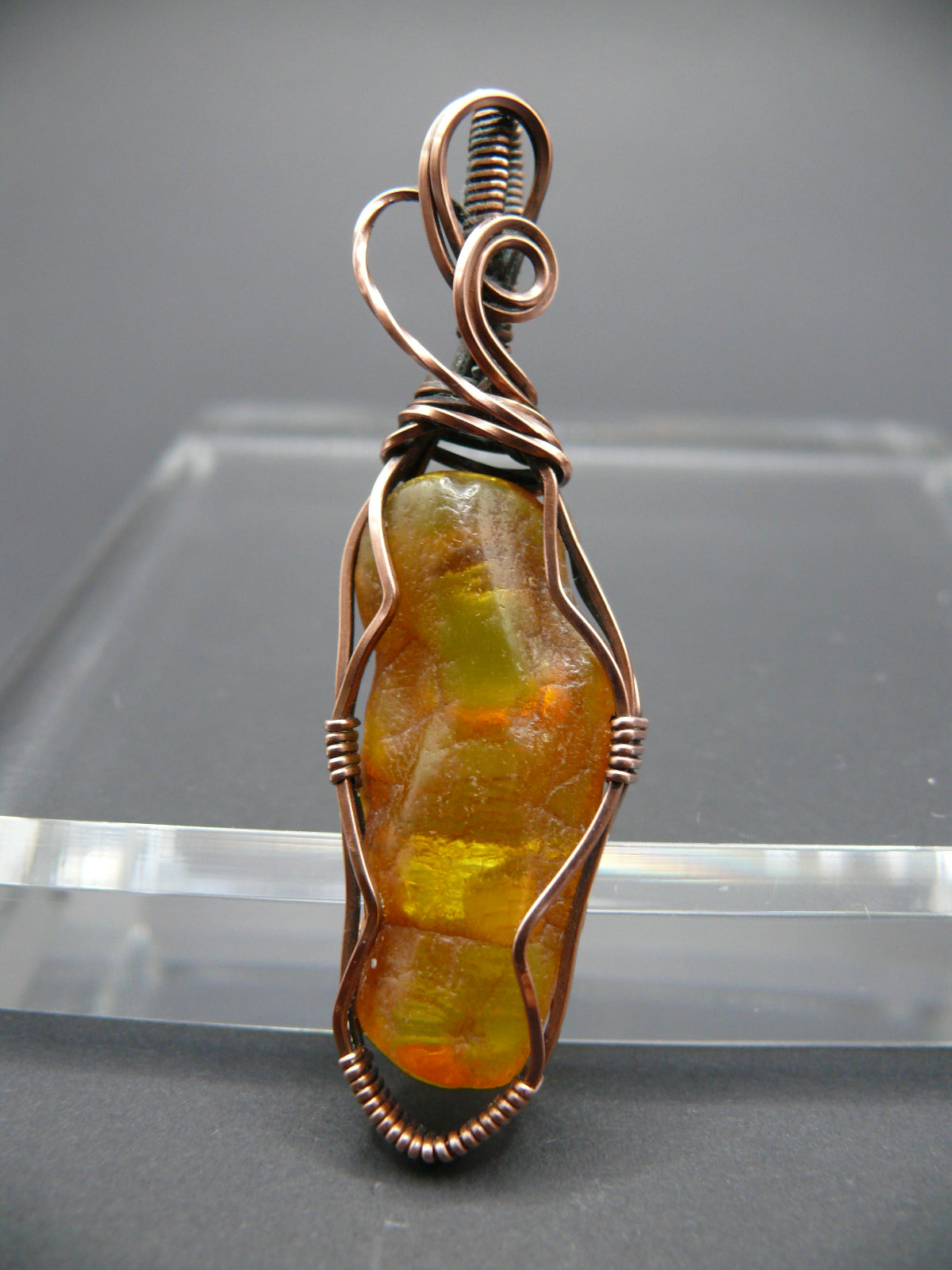 Wire wrapped raw Baltic amber pendant