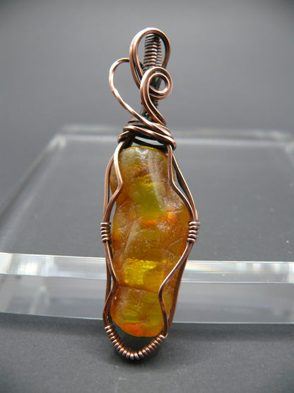 Wire wrapped raw Baltic amber pendant