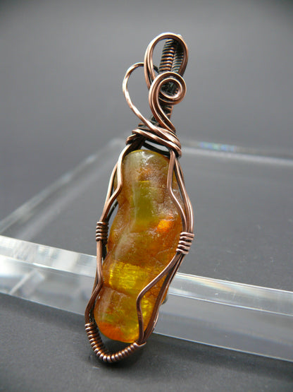 Wire wrapped raw Baltic amber pendant