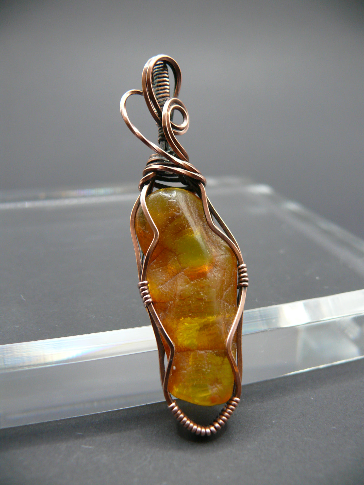 Wire wrapped raw Baltic amber pendant