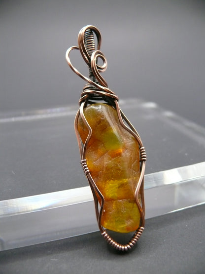 Wire wrapped raw Baltic amber pendant