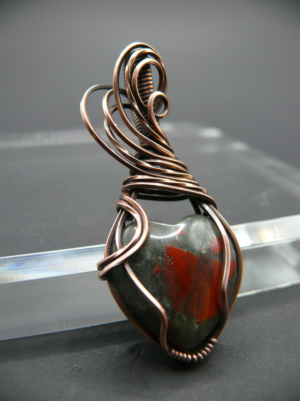 Heart shaped wire wrapped bloodstone pendant