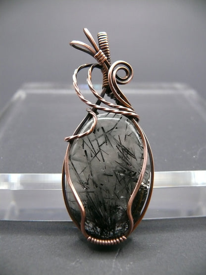 Wire wrapped rutilated quartz pendant