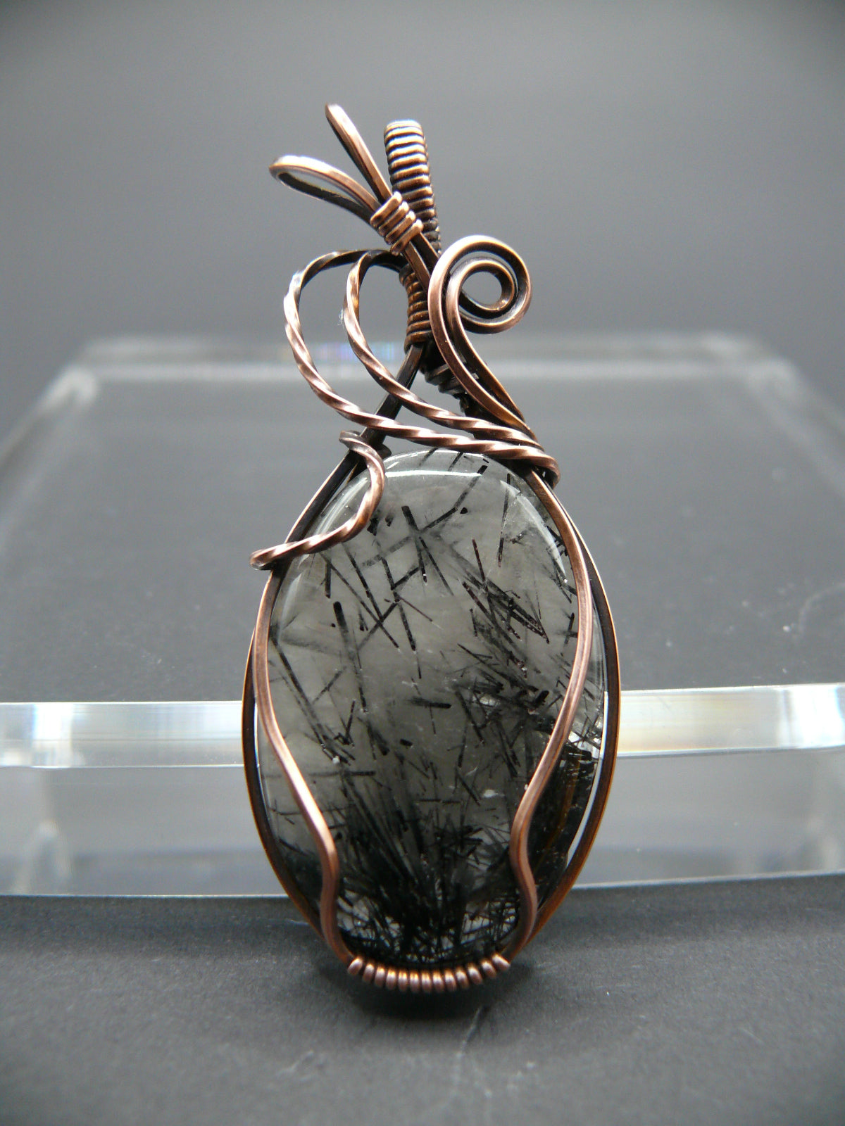 Wire wrapped rutilated quartz pendant