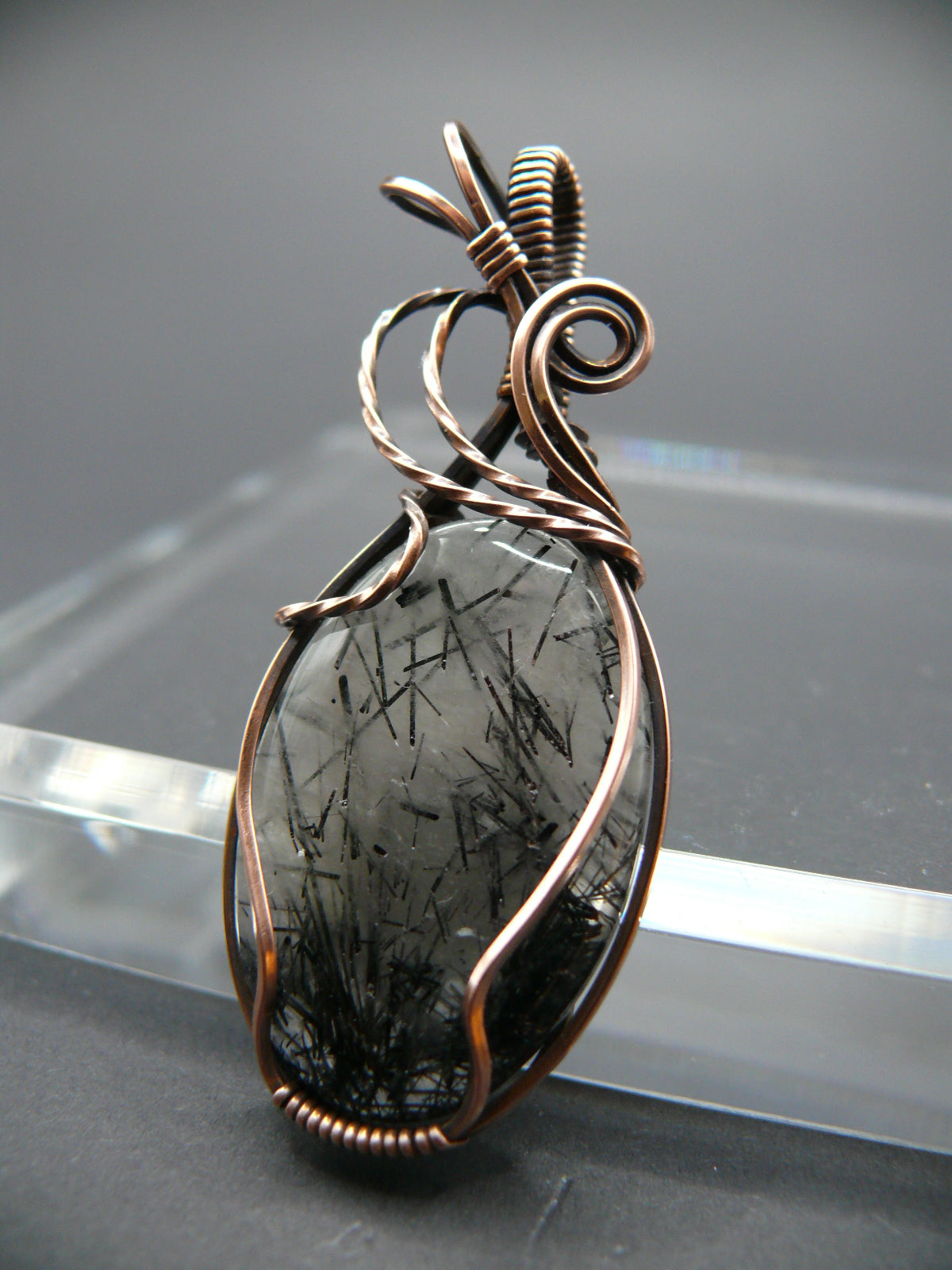 Wire wrapped rutilated quartz pendant