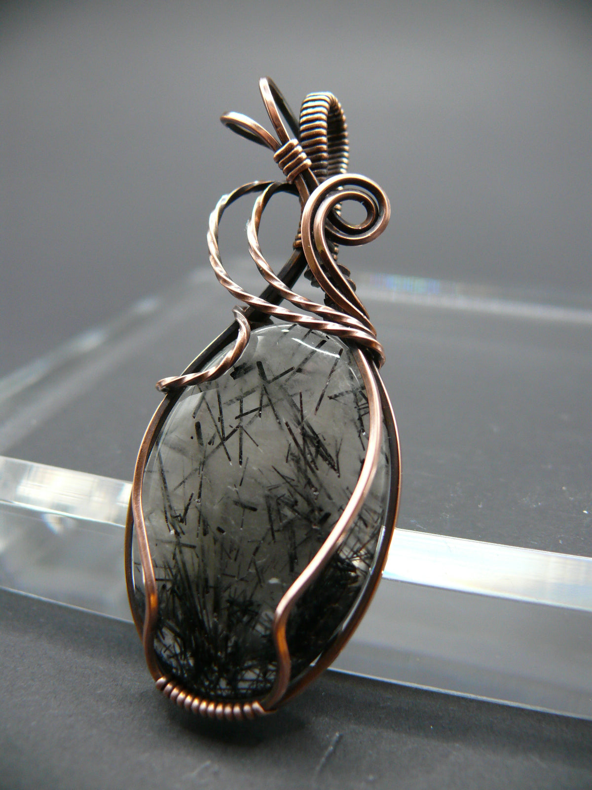 Wire wrapped rutilated quartz pendant