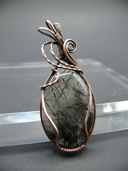 Wire wrapped rutilated quartz pendant