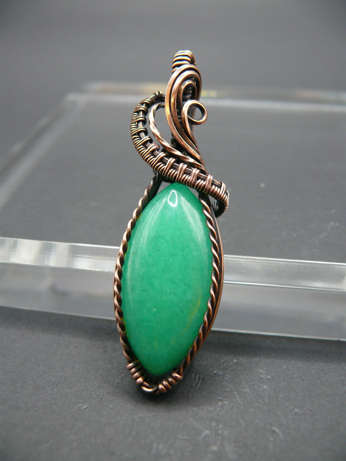 Copper-wrapped Jade gemstone pendant