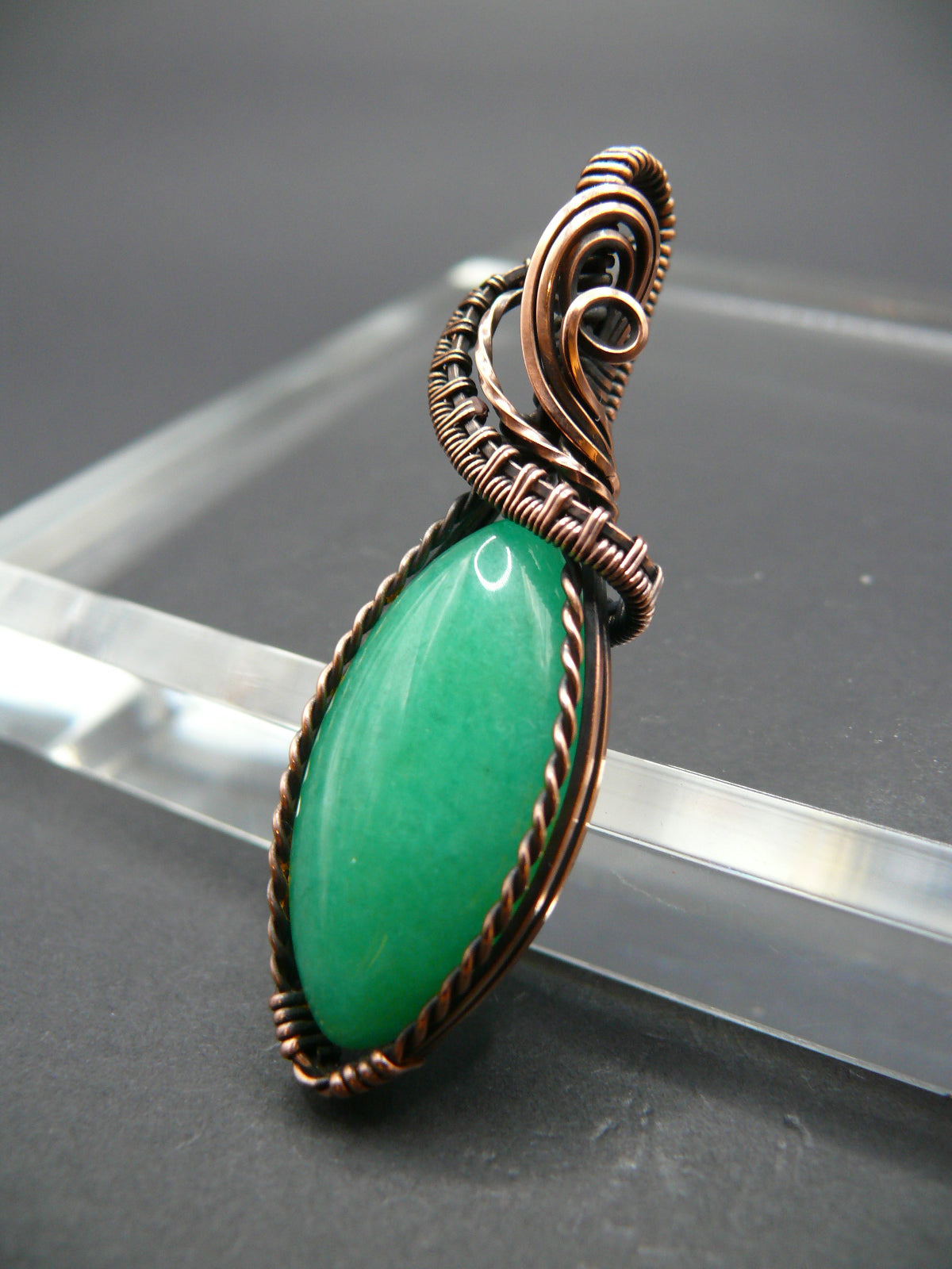 Copper-wrapped Jade gemstone pendant