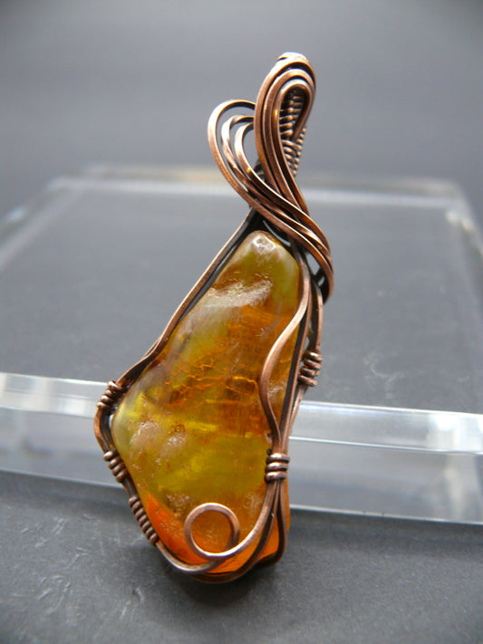 Wire wrapped raw Baltic amber pendant