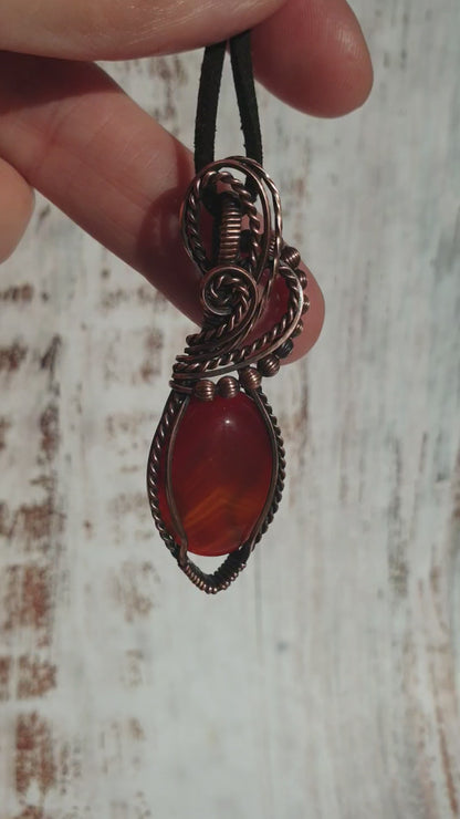 Wire wrapped deep red agate gemstone pendant