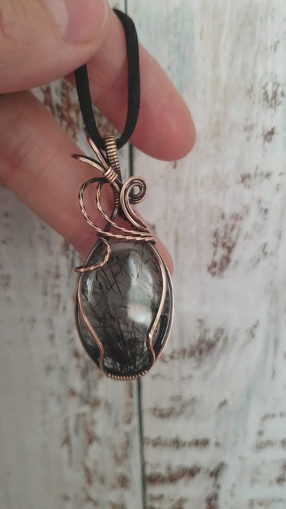 Wire wrapped rutilated quartz pendant